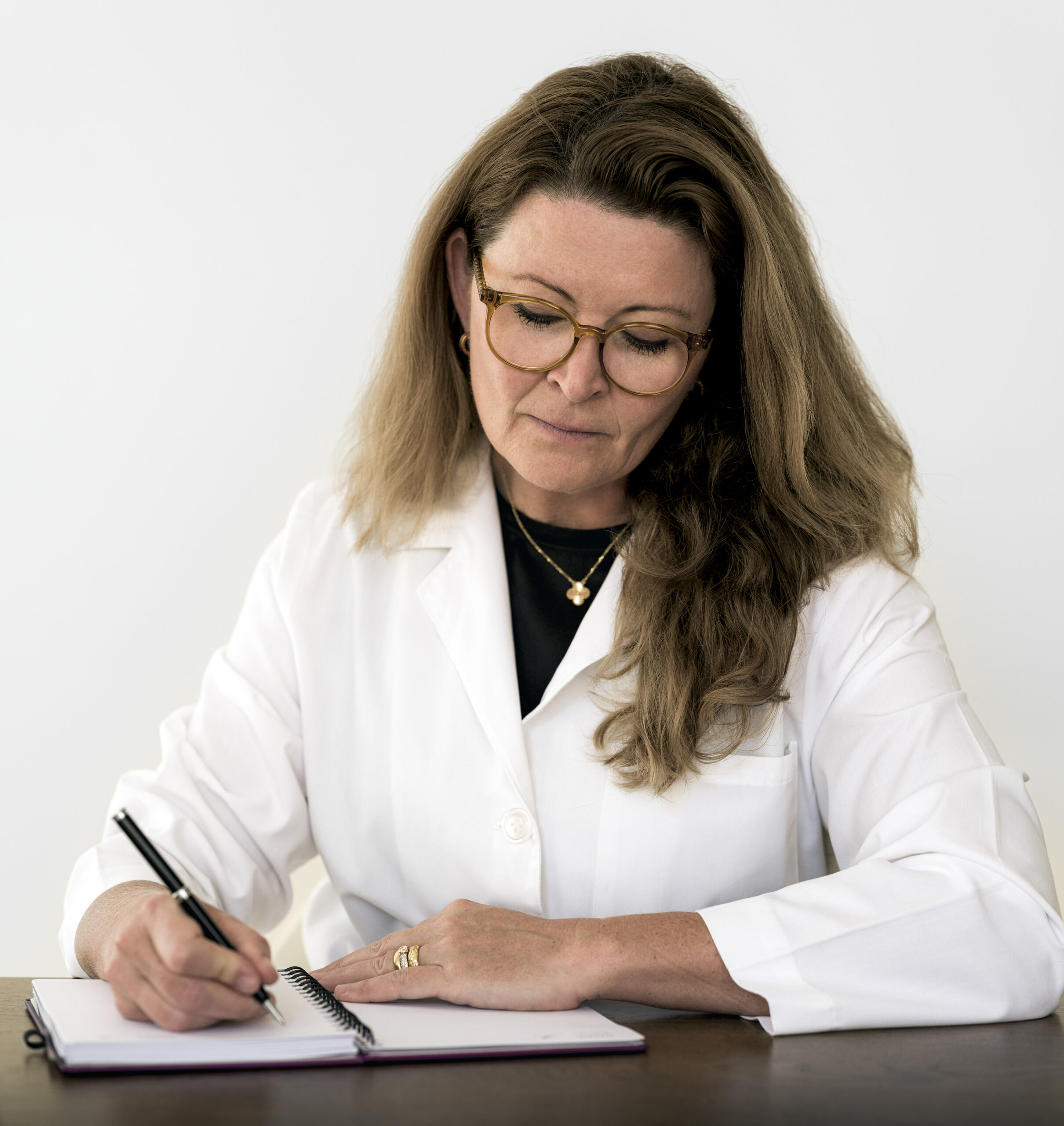 Prof. Elisabet Hagert writing notes